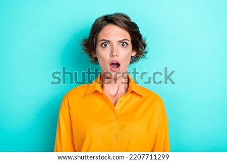Photo of adorable cute nice girl with bob hairdo dressed yellow shirt scared horrified staring isolated on turquoise color background Royalty-Free Stock Photo #2207711299