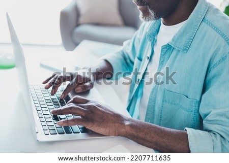 Cropped photo of focused skilled mature programmer businessman working from home typing email message
