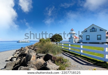 Mukilteo Lighthouse on a sunny day. The lighthouse is an operational navigation aid located on the east side of Possession Sound at Mukilteo, Snohomish County, Washington. Royalty-Free Stock Photo #2207718125