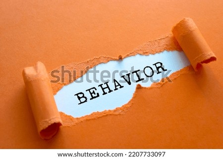 Behavior word written under brown torn paper. Royalty-Free Stock Photo #2207733097
