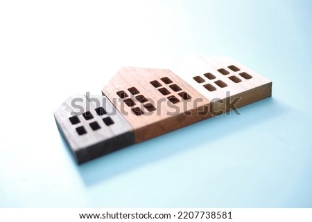A studio photo of toy wooden houses