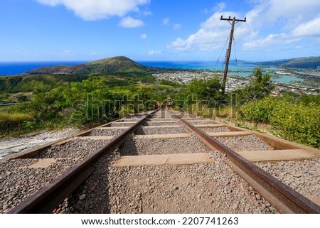 Rail track going downhill on the steep slopes of the Koko Crater Railway Trail offering a view on Hanauma Bay in the suburbs of Honolulu on O'ahu island, Hawaii