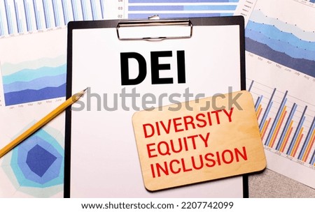 wooden blocks with text DEI on yellow background. dei - short for diversity equity inclusion.