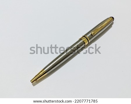 Close Up Metal Pen. With White Background. With a body made of metal and silver