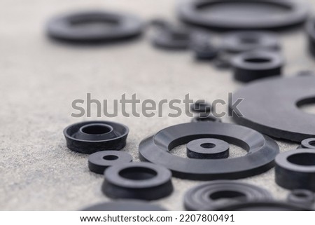 Rubber products gaskets and seals of various shapes for connecting parts of automotive equipment. Heat and frost acid and alkali resistant and oil and petrol resistant technical plates and rings. Royalty-Free Stock Photo #2207800491