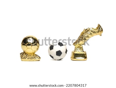 A picture of golden boots, golden ball and football on white background. 