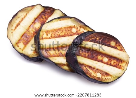 Slices of eggplant roasted on a grill with stripes from a grill isolated on white background