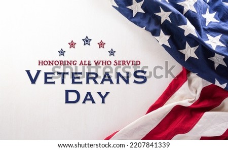 Happy Veterans Day concept. American flags and the text against white background. November 11. Royalty-Free Stock Photo #2207841339