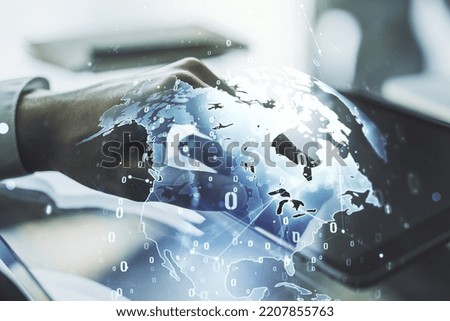 Multi exposure of abstract software development hologram with world map and finger presses on a digital tablet on background, global research and analytics concept