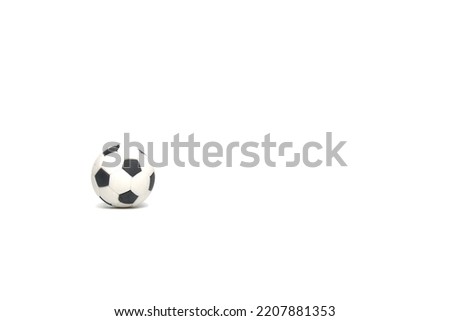 A picture of football ball at isolated copyspace white background.
