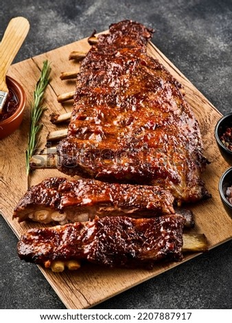 American style pork ribs. Delicious barbecued ribs seasoned with a spicy basting sauce. Royalty-Free Stock Photo #2207887917