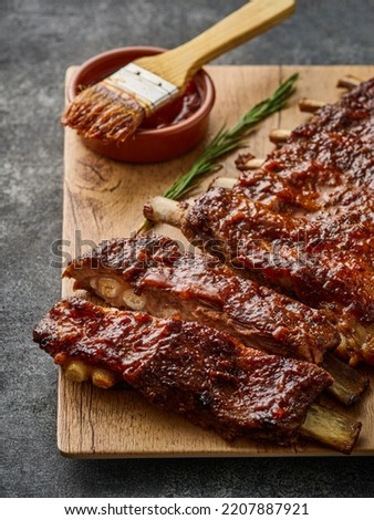 American style pork ribs marinated in barbecue sauce and glazed with honey and bbq souce Royalty-Free Stock Photo #2207887921