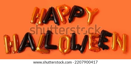 Text HAPPY HALLOWEEN made of balloons on orange background
