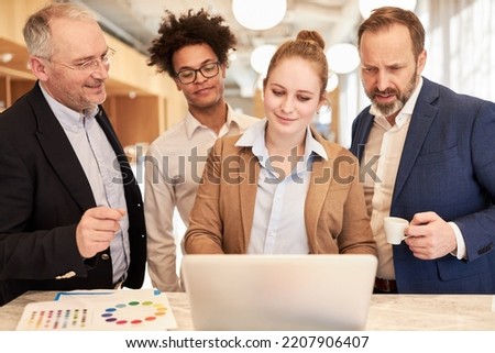 Group of business people as a creative designer team planning on the laptop computer