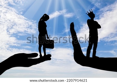 Inequality and sexism. A distressed woman on a begging hand and an arrogant man with a crown standing on the stop hand. Concept of inequality and sexism. Silhouette Royalty-Free Stock Photo #2207914621