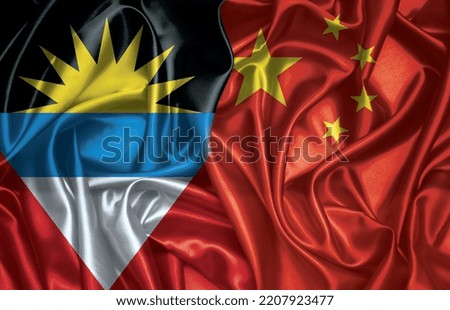 Antigua and Barbuda and China two folded silk flags together