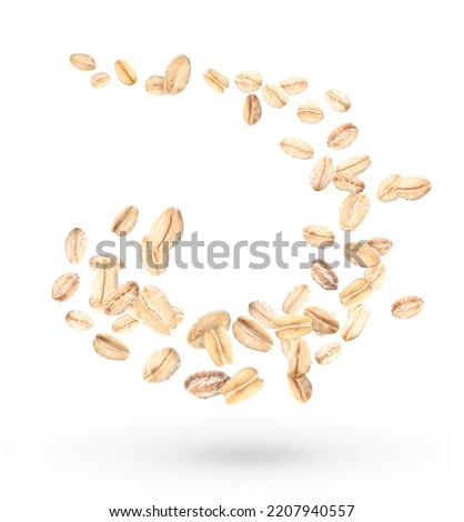 Flying raw oatmeal on white background Royalty-Free Stock Photo #2207940557