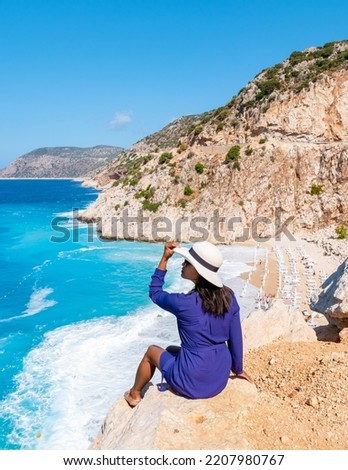 Kaputas beach Lycia coast Turkey Kaputas Beach, young Asian women looking out over the Mediterranean Sea, Kas, Turkey. Royalty-Free Stock Photo #2207980767