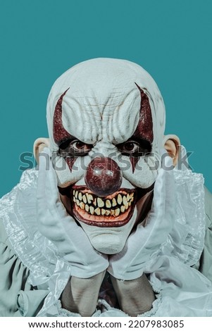 closeup of a mad bald evil clown, wearing a costume with a white ruff, staring at the observer with a creepy smile, leaning his head in his hands, wearing white gloves, on a blue background