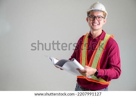 A portrait of a construction engineer with a white background in a photo studio is used for the banner cover of a multi-ethnic civil engineering group Handsome Asian Workers.
