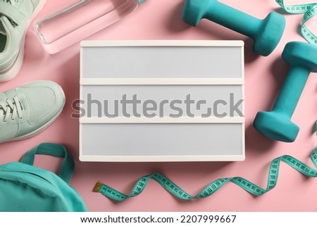 Blank letter board, shoes and sports equipment on pink background, flat lay. Mockup for design
