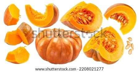 Orange round pumpkins and pumpkin slices and seeds isolated on white background. File contains clipping paths.