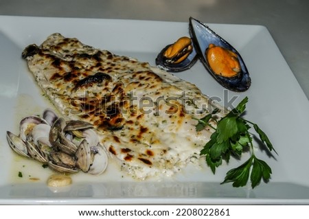 Baked perch with truffles and mayonnaise