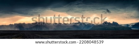 Panorama dramatic of mountain range glacier with asperlitas cloud and sand storm on lava field in the sunset on summer at Iceland Royalty-Free Stock Photo #2208048539