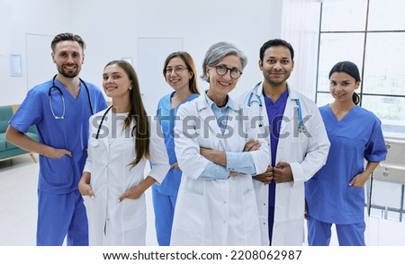 Confident doctors and nurses standing in modern hospital. Medical teamwork, international group of doctors Royalty-Free Stock Photo #2208062987