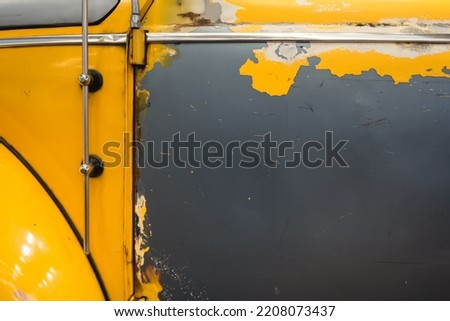 Photo of old yellow car. Grunge background