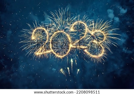 Happy New Year 2023. Beautiful creative holiday web banner or flyer with Golden firework and sparkling number 2023 on night blue sky background. Royalty-Free Stock Photo #2208098511