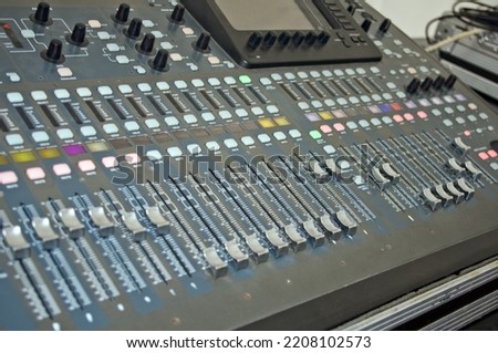 Audio Console. Professional concert sound mixer panel with sliders and regulators 