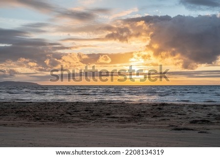 Colorful Sunset on beautiful golden sand beach in Laholm Melbystrand Sweden