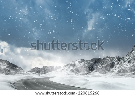 Winter Driving - Winter Road Country road leading through a winter mountain landscape. Royalty-Free Stock Photo #220815268
