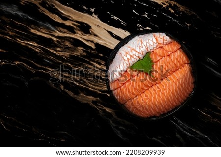 sashimi seafood in Japanese sushi cusine on mable plate in dark background for food advertising concept. Slice raw salmon fish is signature of Japanese food. Photography on top view.