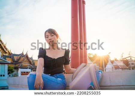 Tourist asian backpack woman tracel in buddhist temple sightseeing in Bangkok Thailand Royalty-Free Stock Photo #2208255035