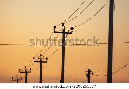 Electric pole on the background of the sunset. 