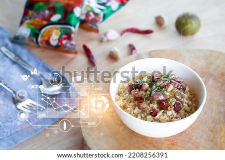 Close up fried rice with meat in white bowl on wooden pad, 