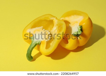 Yellow bell pepper on yellow background, close up