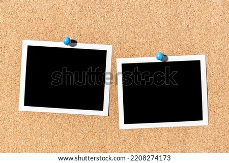 Two Blank Vintage instant photo frame pinned on corkboard. Template Royalty-Free Stock Photo #2208274173