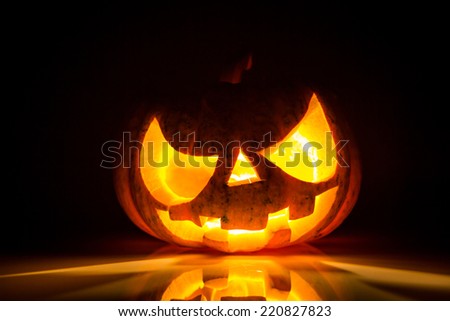 Halloween scary face pumpkin on black background