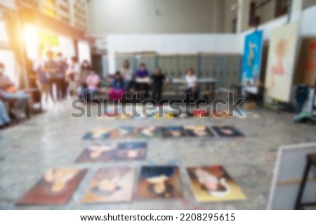 
blurry image of teacher teaching students in art class, Decorate your photos with vintage colors ans Sunlight shines through the window.