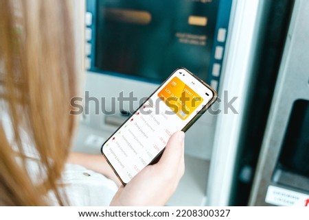 Internet based banking. Girl holding mobile phone with internet online bank app. Credit card wallet application. Online wallet save money