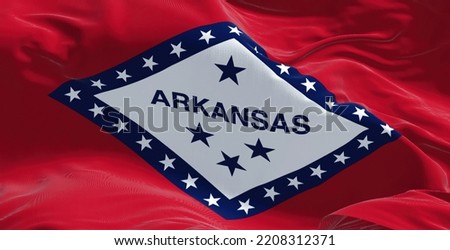 Close-up view of the Arkansas state flag waving in the wind. Arkansas is a landlocked state in the South Central United States. Fabric textured background. Confederate US state Royalty-Free Stock Photo #2208312371