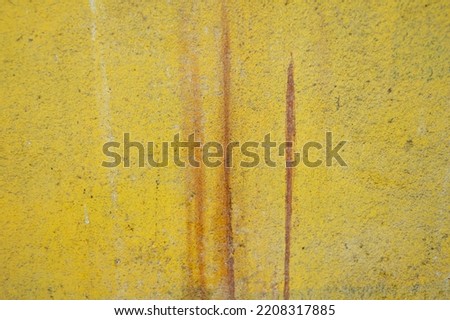 The yellow walls are dirty and old. use as wallpaper
