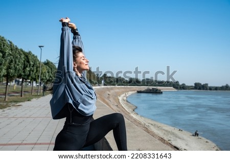 Young woman cancer survivor decides to change her way of life after illness and start practicing every morning as new life routine. Female workout training outdoor for health and happiness.