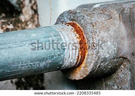 Close-up Rusty on thread of connection galvanized pipe, Electric wire pipe in outdoor, selective focus. Royalty-Free Stock Photo #2208335485