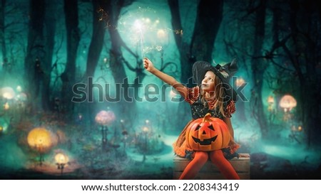 Little Sweet Magic witch girl conjures on white isolated background on halloween 