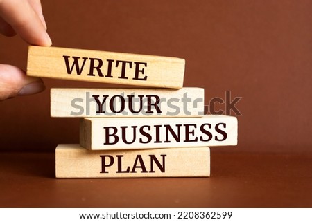 Wooden blocks with words 'Write Your Business Plan'.