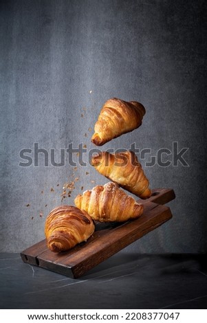 bunch of croissants are flying Royalty-Free Stock Photo #2208377047